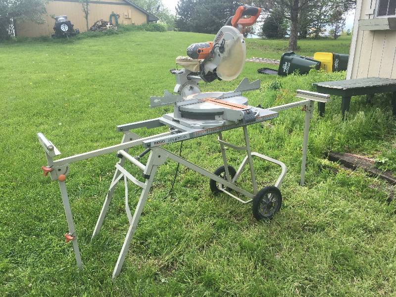 lot 473 image: Ridgid 12 Compound Miter Saw with Utility Vehicle Stand