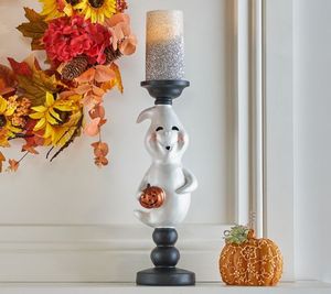 lot 10156 image: Retail - $44.00 Hay & Harvest Resin Ghost Pillar Holder with LED Candle