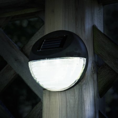 lot 7109 image: Pure Garden Round Solar LED Lights, Black, Set of 4