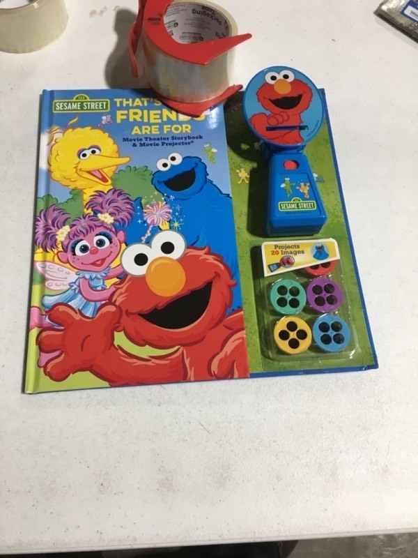 lot 5501 image: Sesame Street Movie Theater Storybook and Projector - by Editors of Studio Fun International (Hardcover)