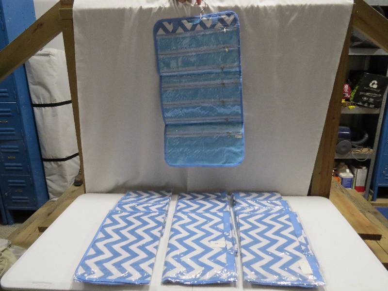 lot 104 image: Lot of 12 Light Blue HangingTravel Jewelry Rolls