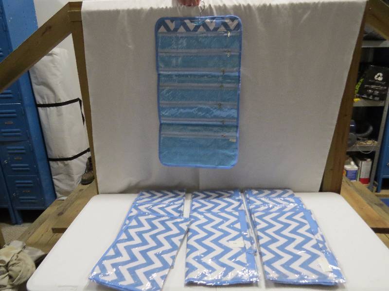 lot 106 image: Lot of 12 Light Blue HangingTravel Jewelry Rolls