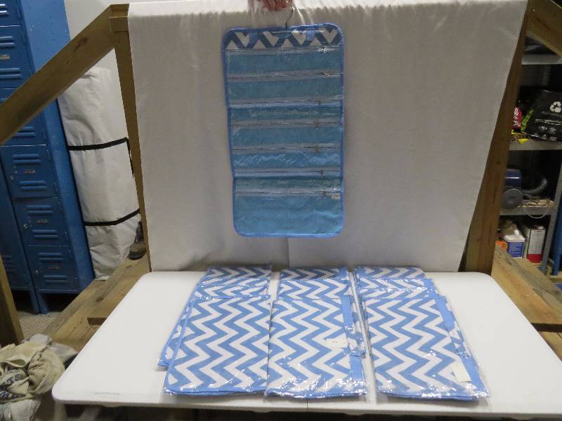 lot 108 image: Lot of 12 Light Blue HangingTravel Jewelry Rolls