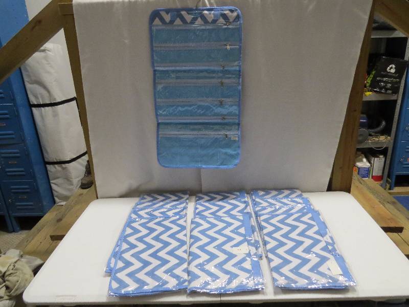 lot 109 image: Lot of 12 Light Blue HangingTravel Jewelry Rolls