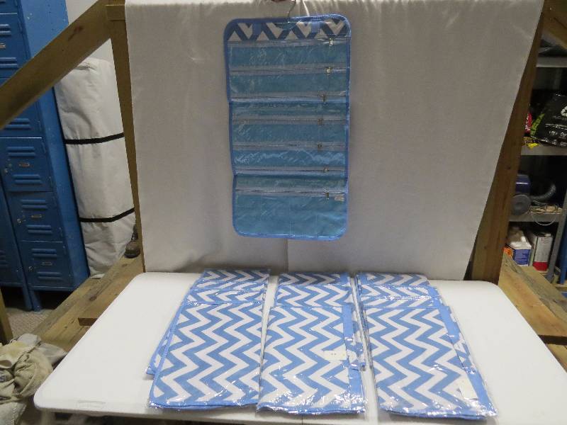 lot 110 image: Lot of 12 Light Blue HangingTravel Jewelry Rolls