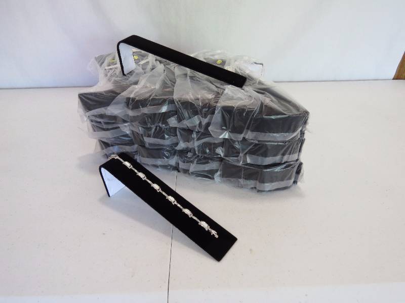 lot 167 image: Lot of 146 Black Velvet Bracelet Display Ramps (jewelry not included)
