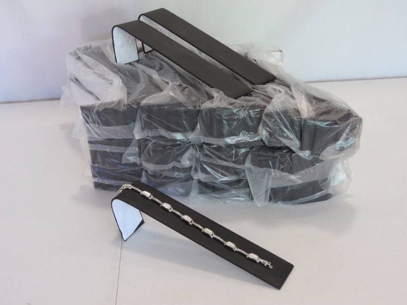 lot 168 image: Lot of 147 Black Leatherette Bracelet Display Ramps (jewelry not included)