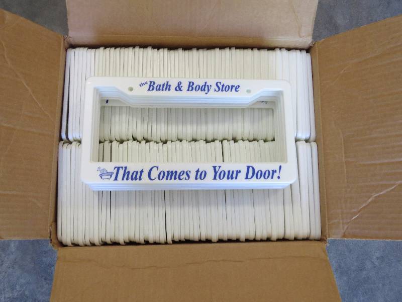 lot 229 image: Lot of 100 Bath & Body Store License Plate Frame