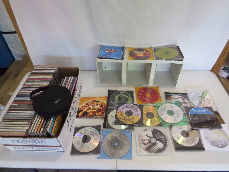 lot 295 image: 70 Assorted Music CDs, CD Rack and CD Case