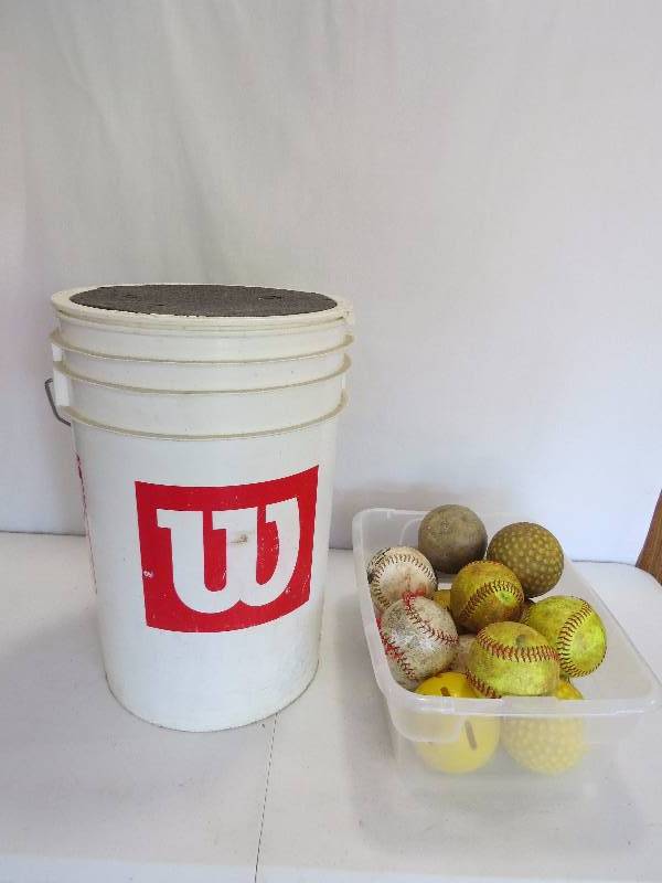 lot 316 image: Wilson Ball Bucket loaded with softballs and other