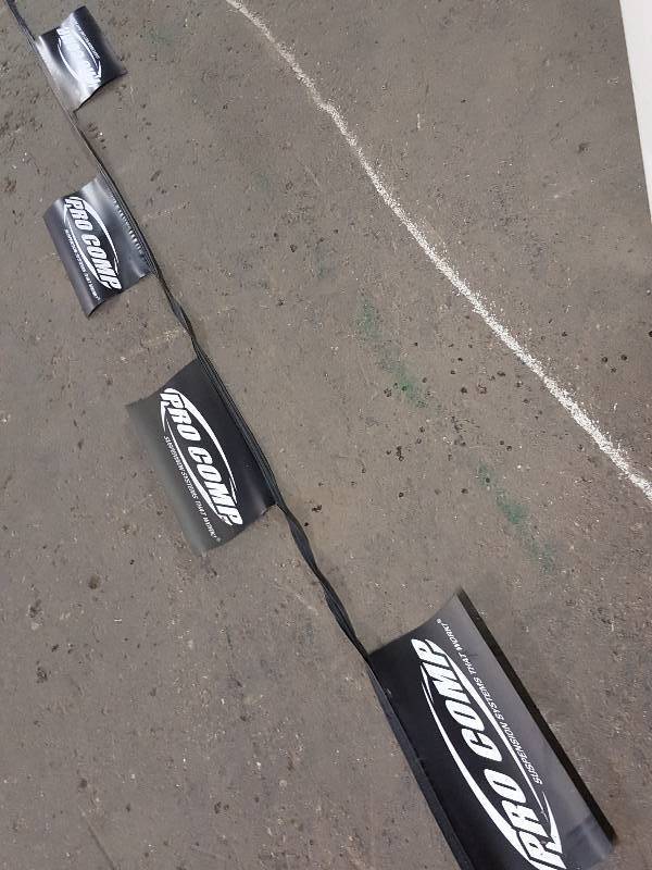 lot 7601 image: 75 feet long vinyl race shop, man cave or decoration Pro Comp flags with a bunch of 14 individual flags on the run.