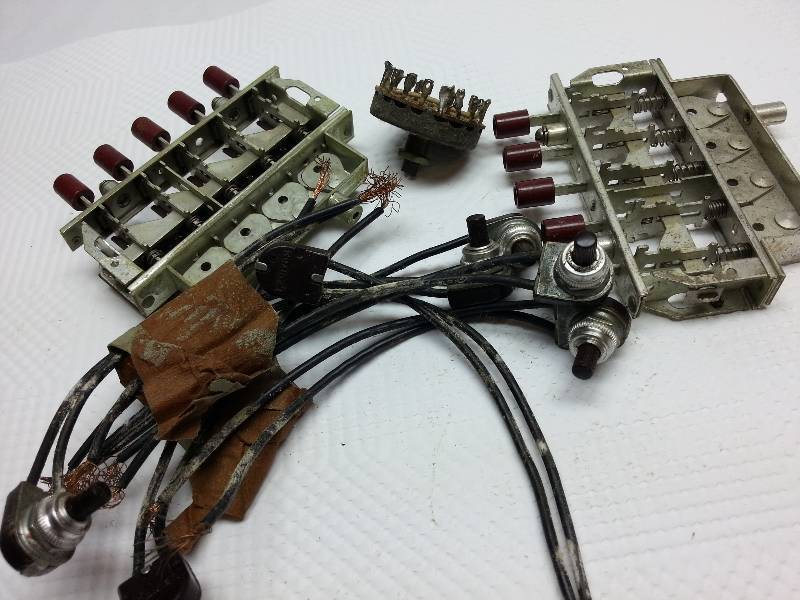 lot 9335 image: Misc push button switches and on off switches too from a tinkerers garage work shop.
