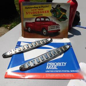 lot 8048 image: Antique 1955 Studebaker Sales Brochure & Emblems