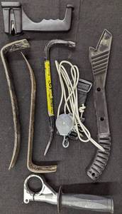 lot 670 image: Crowbars, Drill Handle, Pulley, and Knife Sharpener.