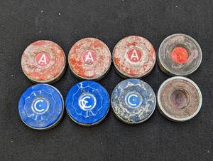 lot 712 image: Shuffle Board Pieces.