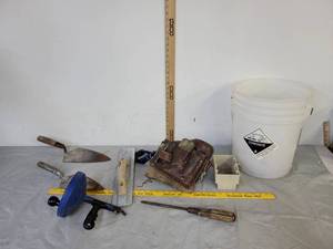 lot 538 image: Plumbing snake  (2) brick layers pointing trowel & tool bag