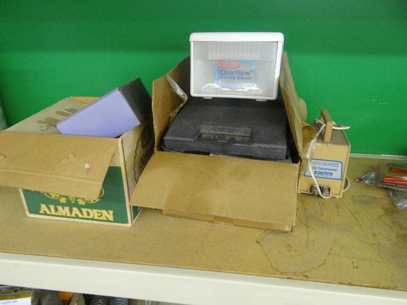 lot 429 image: Air compressor 561 series, paint supplies storage bin, & carry case.