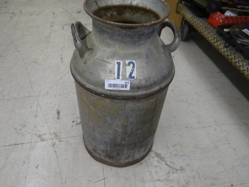 lot 464 image: Metal milk jar.