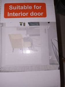 lot 17675 image: Retractable Safety Gate For Kids and Pets 33 in. x 55 in. max