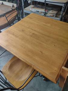 lot 1636 image: 40 inch by 40 inch square wood top and wrought iron table and four chairs has two captains chairs two side chairs and one leaf