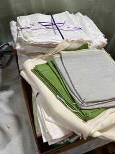 lot 5253 image: flat full of kitchen linens. Potholders, napkins, small tablecloth ect.