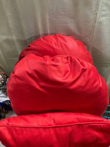 lot 5260 image: 2) 16�� Red round pillows.1) 18�� oblong pillow.