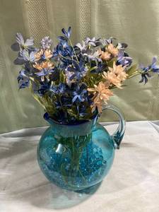lot 7698 image: Blue glass pitcher with flowers and marbles stands 8 inches
