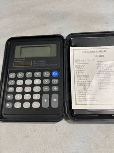 lot 7746 image: Calculator, in hard case works notepads dated 1994 & 95
