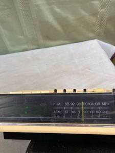 lot 7749 image: Panasonic AMFM band electronic clock, radio untested lights up(in metal building