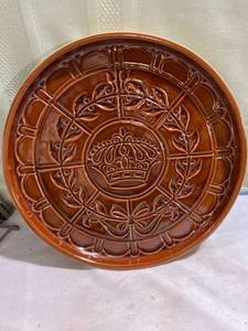lot 7998 image: 11 12 inch round terra-cotta tray Crown glazed on it