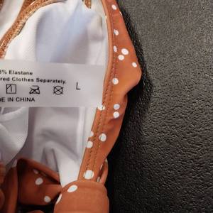 lot 7513 image: Brown and white polka. one piece swimsuit., large