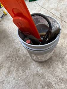 lot 1035 image: 5 Gallon Bucket of Chainsaw Accessories, etc