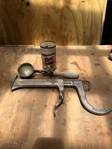 lot 1104 image: Vintage Ice Cream Scooper, Lady Josephine Shoeshine Holder, Storz Beer Can