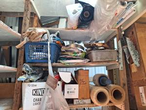 lot 4606 image: Contents of Shelf - Assortment of Closet Brackets, Partial Rolls of Painters Plastic, Retention Shower Curtain Rods