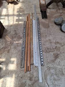 lot 1718 image: Lot of surveyors story pole, 4 ft level, 8 ft straight edge, track saw tracks, Metal Brackets and Wooden Bar Rods