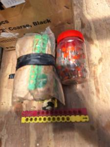 lot 1736 image: Lot of powder actuated Caliber Strip Cartridges and Jar of Nails