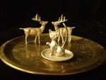 3 metal figurines with metal plate