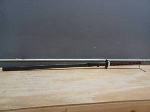 lot 23121 image: Black Katana Sword With Red Accent On Handle, Metal Blade But Not Sharp