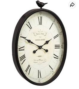 lot 61068 image: $$ Creative Co-Op Oval Metal Wall Clock with Bird. Retail $105