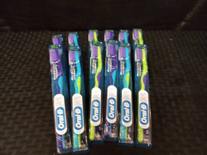 lot 201 image: Oral-B Control Grip Pro Health Tooth Brushes