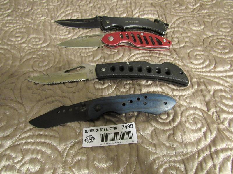lot 7498 image: Lot of 4 Pocket Knives - 1 Sheffield, 1 Wolfe (red), 1 blue and one black