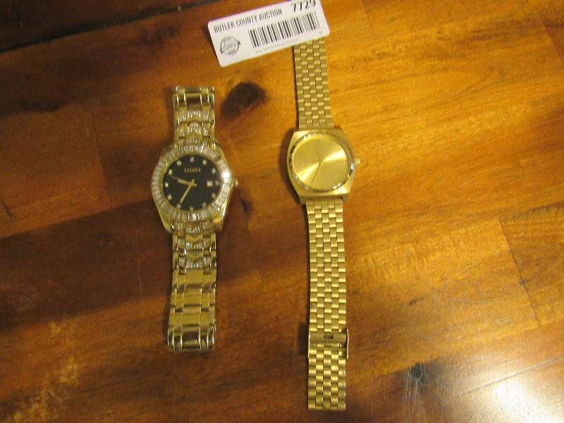 lot 7729 image: Lot of two watches - Elgin (missing a stone) & Nixon (very good condition)