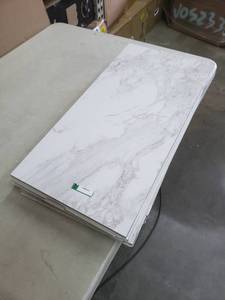 lot 2464 image: White Marbled Ceramic Tile, 5 Tiles Total, 11.5x23.5 Each