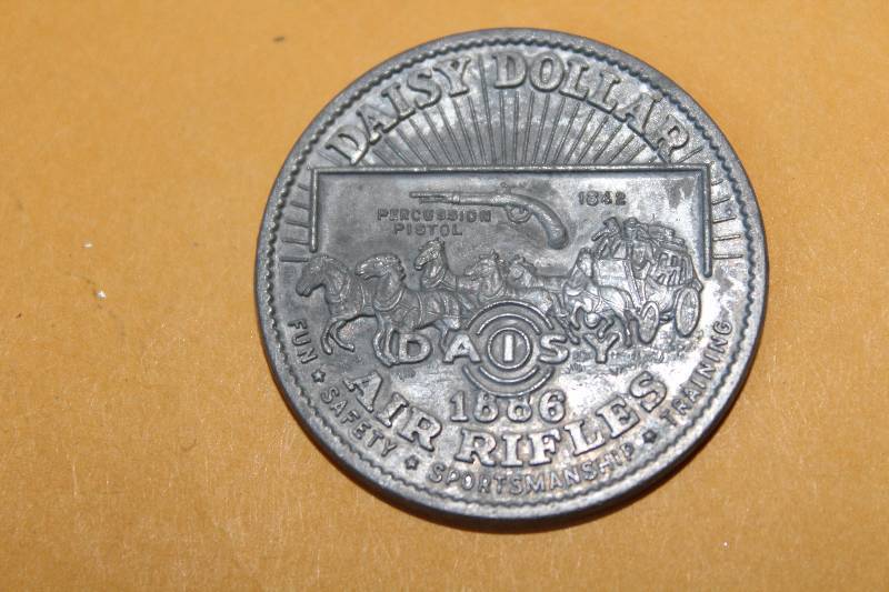 lot 8469 image: Daisy Dollar 1886 - dated 1942 - Daisy Air Rifles - FUN  SAFETY  SPORTSMANSHIP  TRAINING - very collectible