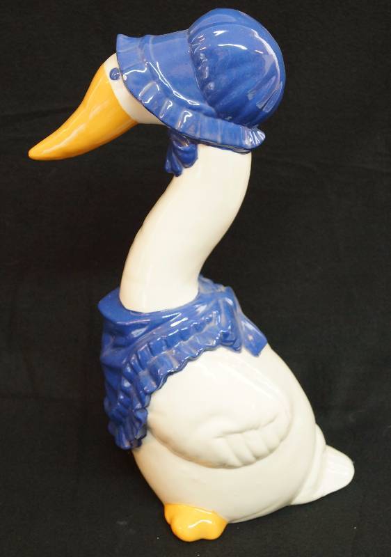 lot 4097 image: Big Ceramic Mother Goose - Once Upon a Time � See photos for measurements. She has a chip on the end of her beak and on her hat that can easily be touched up. Shes cute