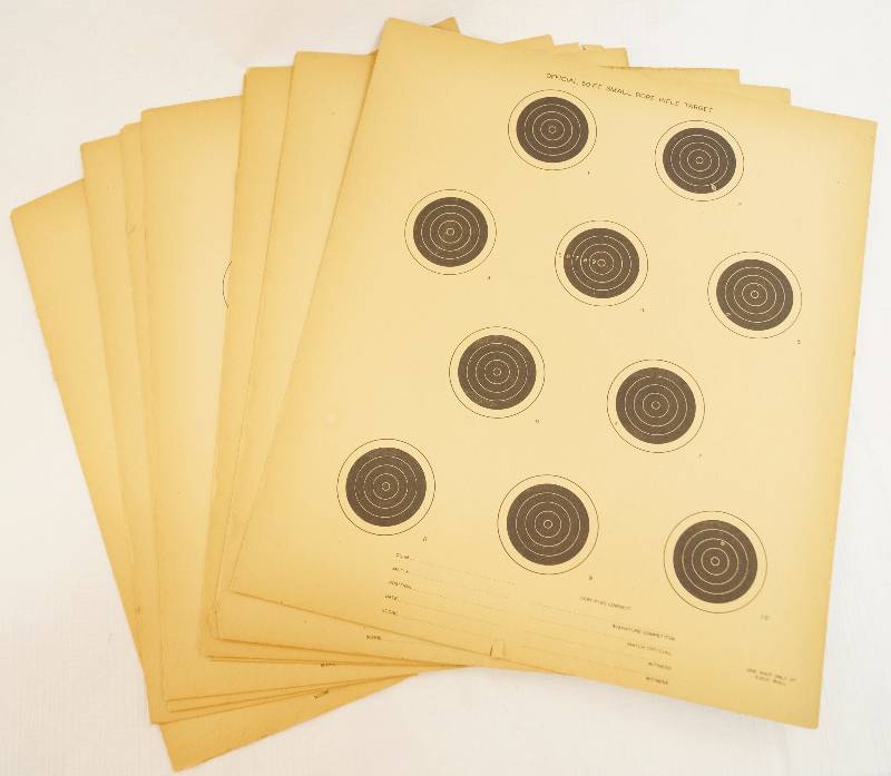 lot 4117 image: Lot of 22 Vintage OFFICIAL 50FT. SMALL BORE RIFLE TARGET - Most are in great shape with darkened edges. Two show wear but are still nice. Added bonus, a pack of Hot Hands Hand Warmers