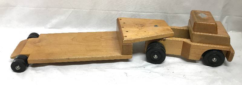 lot 4087 image: Wooden toy truck with detachable flat bed trailer - very sturdy, awesome toys See photos for size. This is really cool Community brand
