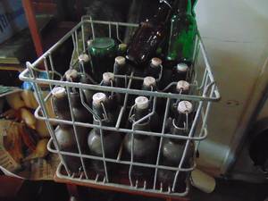 lot 4748 image: Milk crate full of Grolsch beer bottles