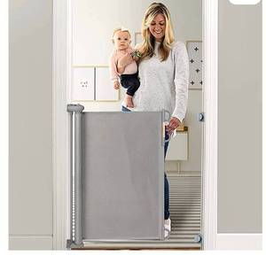 lot 55891 image: Momcozy Retractable Baby Gate, 33 Tall, Extends up to 55 Wide, Child Safety Baby Gates for Stairs, Doorways, Hallways, Indoor, Outdoor (Retail $40.99)