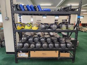 lot 12875 image: Rack and Paintball Equipment W Approx 15 Guns and 50 Face Shields